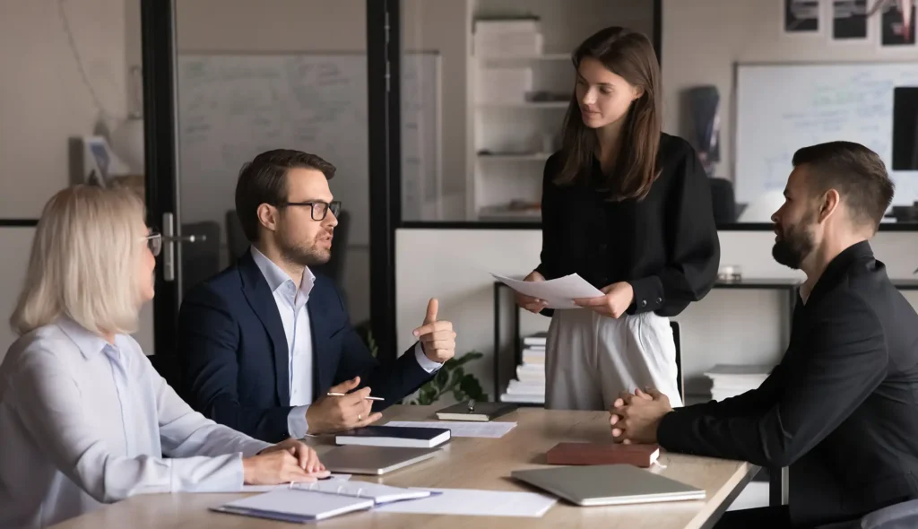 discussing work-related matters gathered in meeting room